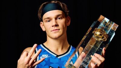 Mac McClung holding Slam Dunk trophy