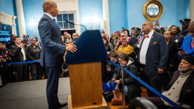 Eric Adams speaking at a podium